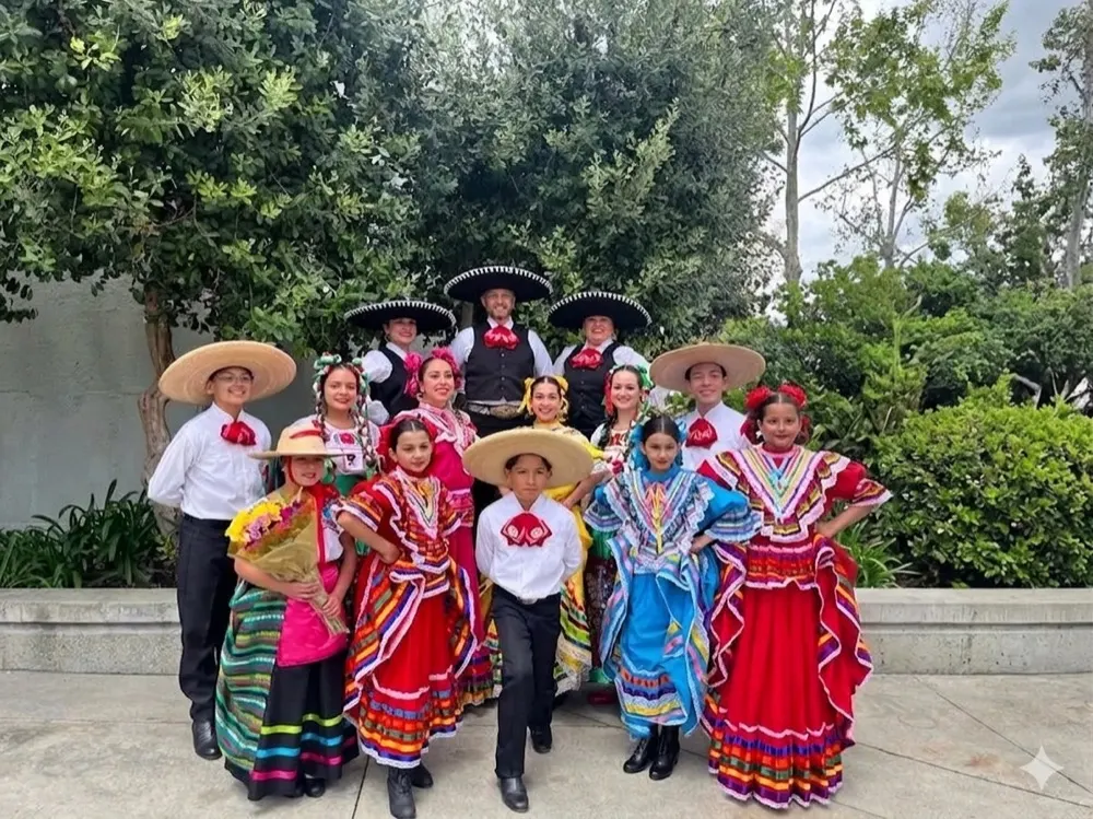 Ballet Folklórico Mi Herencia group photo at a fair