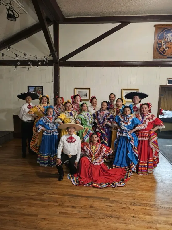 Full group portrait in traditional attire